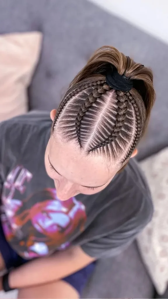Sculpted Top Knot with Braided Details Dance Hairstyle
